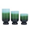 The Novogratz 3-Slot Green Glass Pillar Hurricane Lamp